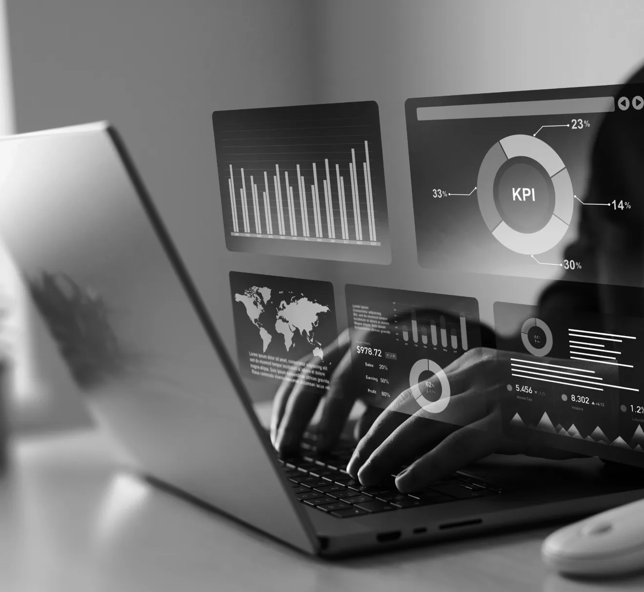 A person sitting in front of a laptop working with exposure management dashboards.