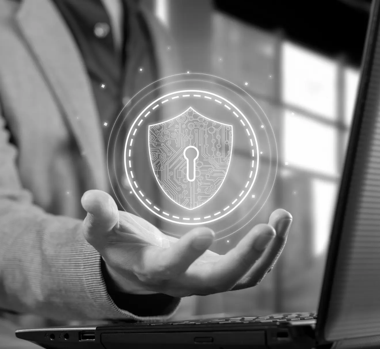 A person holding a security icon in their palm